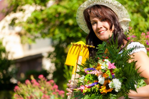Gardener wearing PPE while operating equipment